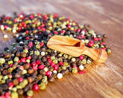 A variety of fresh regional ingredients arranged on a bright kitchen workspace table
